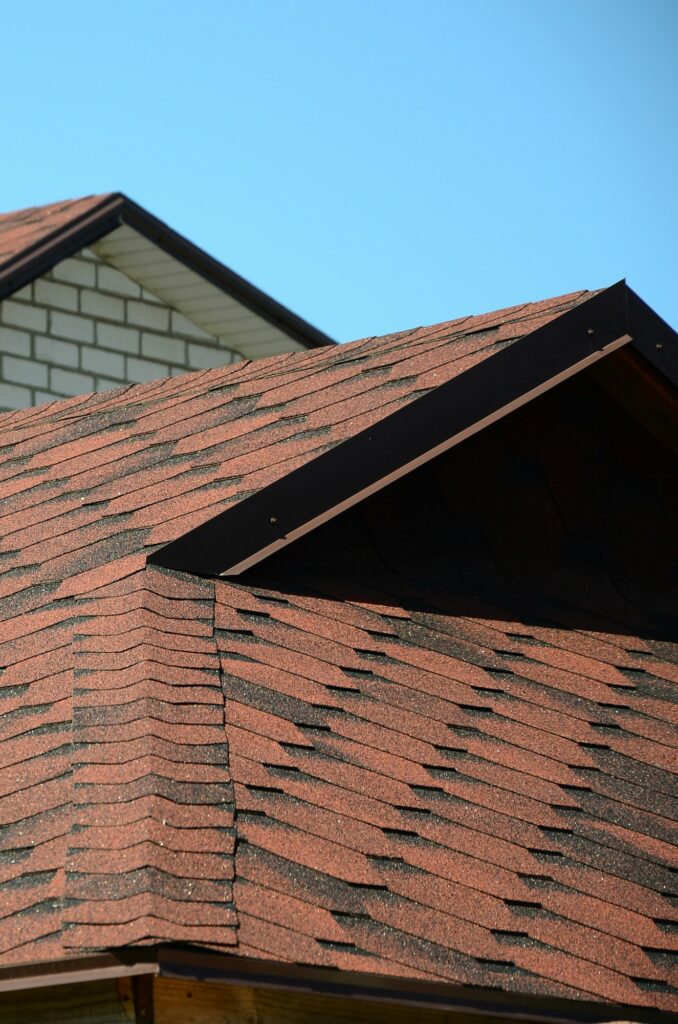 The roof is covered with bituminous shingles of brown color. Quality Roofing